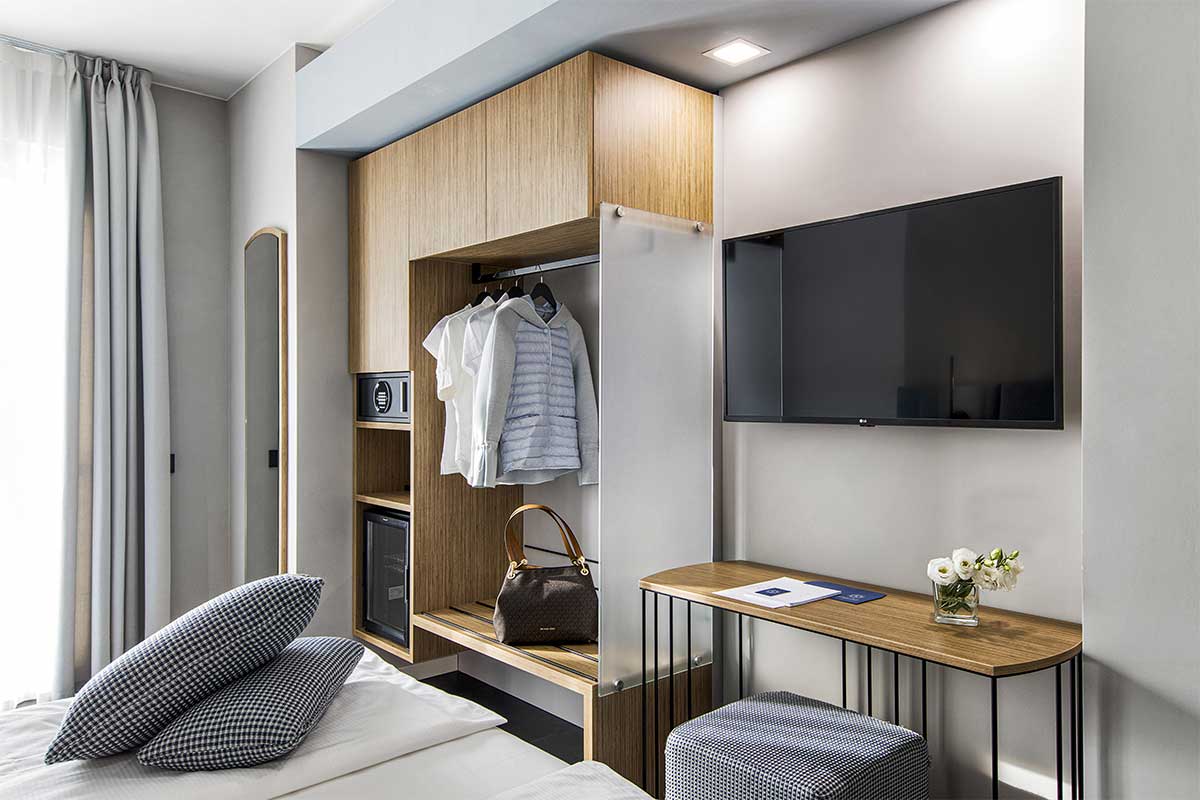 https://gruppo5.it/wp-content/uploads/2025/05/10-arredamento-camere-moderne-legno-boutique-hotel.jpg